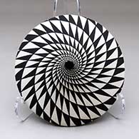 Click for a larger view A black on white tear drop jar decorated with a spiral mesa geometric design
by Dorothy Torivio of Acoma