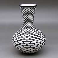 A black on white vase decorated with a geometric design
 by Paula Estevan of Acoma