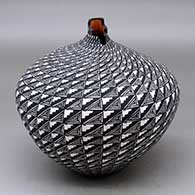 A polychrome tear drop jar with a kiva step cut opening and decorated with a geometric design
 by Sandra Victorino of Acoma