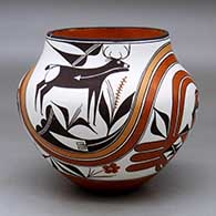 A polychrome jar decorated with a deer-with-heart-line, parrot, rainbow, plant and geometric design
 by Franklin Peters of Acoma