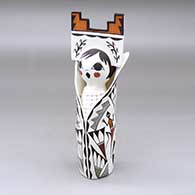 A polychrome Corm Maiden figure wearing a tablito and decorated with a bird, lizard, butterfly, corn stalk and geometric design
 by Judy Lewis of Acoma