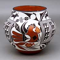 A polychrome jar decorated with a six panel parrot, flower, fineline, deer-with-heart-line and geometric design
 by Franklin Peters of Acoma