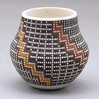 A miniature polychrome jar decorated with a tiny square and kiva step geometric design
 by Frederica Antonio of Acoma