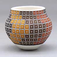 A small polychrome jar decorated with a four-panel geometric design built of tiny colored squares
 by Frederica Antonio of Acoma