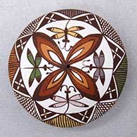 A polychrome seed pot decorated on top with a dragonfly, flower and geometric design
 by Diane Lewis of Acoma