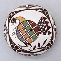 A polychrome seed pot decorated on top with a turkey, leaf, branch and geometric design
 by Diane Lewis of Acoma
