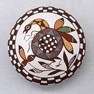 A polychrome seed pot decorated on top with a bird, plant, checkerboard and geometric design
 by Diane Lewis of Acoma