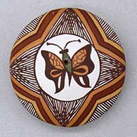 A polychrome seed pot decorated on top with a butterfly, fineline and geometric design
 by Diane Lewis of Acoma
