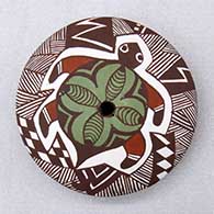 A polychrome seed pot decorated on top with a turtle, fineline and geometric design
 by Diane Lewis of Acoma