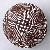 A black on white seed pot decorated on top with a fineline, checkerboard and geometric design
 by Diane Lewis of Acoma