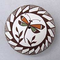 A polychrome seed pot decorated on top with a dragonfly, fineline and geometric design
 by Diane Lewis of Acoma