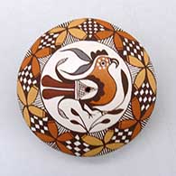 Click for a larger view A polychrome seed pot decorated on top with a parrot, yucca-leaf snowflake, fineline and geometric design
by Diane Lewis of Acoma