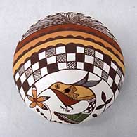 A polychrome seed pot decorated on top with a hummingbird, flower, yucca-leaf snowflake, fineline, rainbow, checkerboard and geometric design
 by Diane Lewis of Acoma