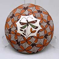 A polychrome seed pot decorated on top with a dragonfly, yucca-leaf snowflake, fineline and geometric design
 by Diane Lewis of Acoma