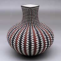 A polychrome jar with a short, square neck and decorated with a spiral checkerboard and geometric design
 by Paula Estevan of Acoma