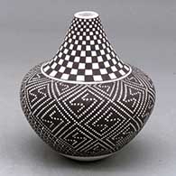 A small tear drop jar decorated around the body with a tiny squares geometric design and around the neck with a checkerboard design
 by Frederica Antonio of Acoma