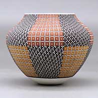 A polychrome jar decorated with an eight panel tiny squares geometric design, click or tap to see a larger version
