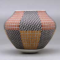 A polychrome jar decorated with an eight panel tiny squares geometric design, click or tap to see a larger version