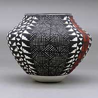 A polychrome jar decorated with a four panel fineline, checkerboard, kiva step and geometric design, click or tap to see a larger version