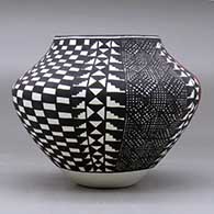 A polychrome jar decorated with a four panel fineline, checkerboard, kiva step and geometric design, click or tap to see a larger version