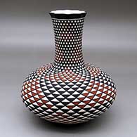 Click for a larger view A tall neck polychrome vase with a pie crust rim and decorated with a spiral mesa geometric design
 by Paula Estevan of Acoma