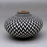 Click for a larger view A black on white jar decorated with a basket weave geometric design
 by Paula Estevan of Acoma