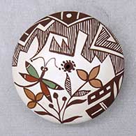 Click for a larger view A polychrome seed pot decorated with a dragonfly, flower, plant, fineline and geometric design
 by Diane Lewis of Acoma