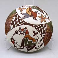 Click for a larger view A polychrome seed pot decorated with a cloudeater, fish, hummingbird, flower, checkerboard, fineline and geometric design
 by Diane Lewis of Acoma