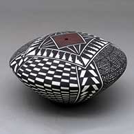 A polychrome seed pot decorated with a checkerboard, fineline and geometric design
 by Sandra Victorino of Acoma