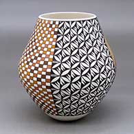 A polychrome jar decorated with a four panel tiny squares, checkerboard and geometric design
 by Frederica Antonio of Acoma