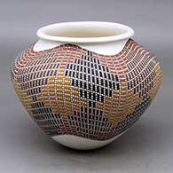 A polychrome jar with a a rolled lip and decorated with a tiny squares geometric design
 by Frederica Antonio of Acoma