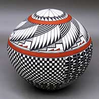 A polychrome seed pot decorated with a feather, checkerboard, flower and geometric design
 by Cletus Victorino of Acoma