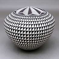 A black on white seed pot decorated with a spiral mesa and geometric design
 by Cletus Victorino of Acoma
