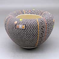 A polychrome jar with an Infinity rim and decorated with a Pacman and four panel tiny squares geometric design
 by Frederica Antonio of Acoma
