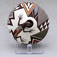 A polychrome seed pot decorated with lizard head and lady bug appliques and a painted lizard, lady bug, fineline and geometric design
 by Carolyn Concho of Acoma