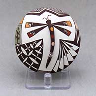 A polychrome seed pot decorated with dragonfly body and lady bug appliques and a painted dragonfly, lady bug, fineline and geometric design
 by Carolyn Concho of Acoma