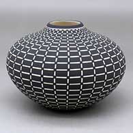 A black on white jar decorated with a geometric design
 by Paula Estevan of Acoma