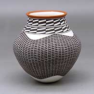 A polychrome jar with a recurved neck and decorated with a tiny squares and geometric design
 by Frederica Antonio of Acoma