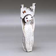 A polychrome Corn Maiden figure wearing a tablito and decorated with a bird, flower, dragonfly, butterfly and geometric design
 by Judy Lewis of Acoma