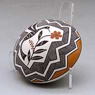 A polychrome seed pot decorated above the shoulder with a hummingbird, flower, fineline and geometric design, click or tap to see a larger version