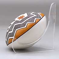 A polychrome seed pot decorated above the shoulder with a hummingbird, flower, fineline and geometric design, click or tap to see a larger version