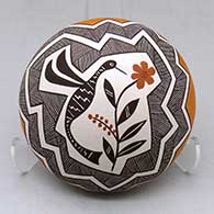 A polychrome seed pot decorated above the shoulder with a hummingbird, flower, fineline and geometric design
 by Rebecca Lucario of Acoma