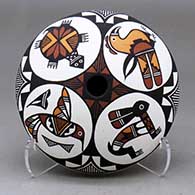 A polychrome seed pot decorated above the shoulder with four medallions with a hummingbird, rabbit, turtle and parrot, all surrounded by geometric design
 by Marilyn Ray of Acoma