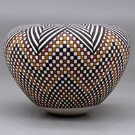 A polychrome jar with an Infinity rim and decorated with a herringbone and tiny squares geometric design, click or tap to see a larger version