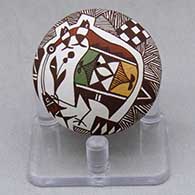 A miniature polychrome seed pot decorated with a cloudeater, fish, fineline, checkerboard and geometric design
 by Diane Lewis of Acoma