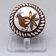 A miniature polychrome seed pot decorated with a bird and geometric design
 by Diane Lewis of Acoma