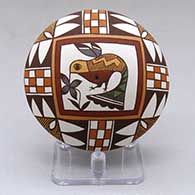 A polychrome seed pot decorated above the shoulder with a hummingbird, flower and geometric design
 by Diane Lewis of Acoma