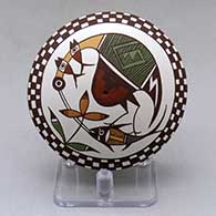 A polychrome seed pot decorated above the shoulder with a cloudeater, fish, plant, checkerboard and geometric design
 by Diane Lewis of Acoma