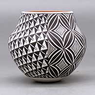 A small polychrome jar decorated with a two panel spiral mesa, fineline and geometric design, click or tap to see a larger version