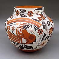 A polychrome jar decorated with a three panel parrot, branch, flower, double rainbow and geometric design
 by Joseph Cerno of Acoma